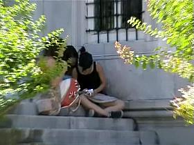 Brunette bimbo sitting on the ground and flashing blue panty