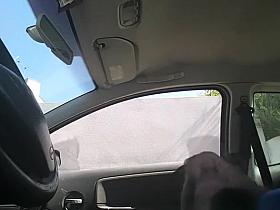 Dude plays with his dick inside his car