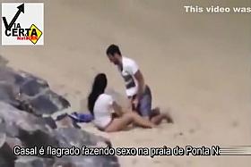 Italian lovers having missionary sex on the beach