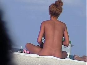 Tanned pierced marvelous babe getting recorded on the nudist beach