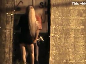 Leggy slut spied sucking dick in an alley