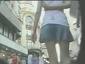 Slender cutie exposes her juicy ass to an upskirt voyeur