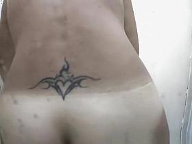 Tattooed nice ass woman in shower cabin