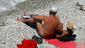 Nude beach relaxation and gentle penis stroking