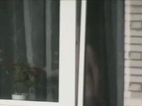 Naked mature woman caught from bedroom window by a voyeur