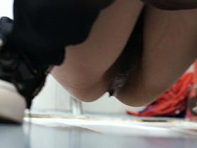 Hot upskirt pissing videos filmed in a public toilet.