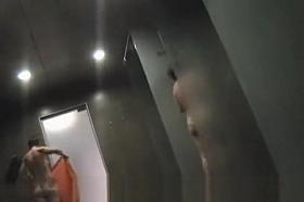 a crowd of naked women washing in the shower