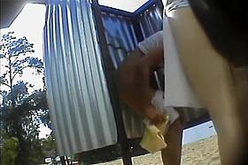 Teenage girl puts a skirt on