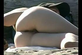 XXX sunny nudist beach porno of a pleasant white ass jiggling