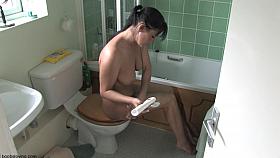 Cutie in boots allows a free down blouse view of her tits