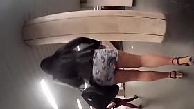 Long legged woman in a short skirt gets followed by a spy c