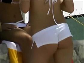 Perky girl's ass spied while she stands