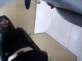 Asian woman takes a pee