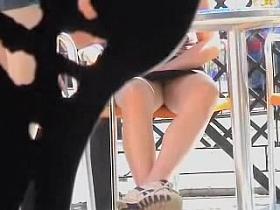 Exciting striped panty seen up skirt of sitting babe AA31