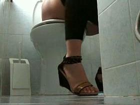 Toilet blonde girl pissing having no clue to be spied