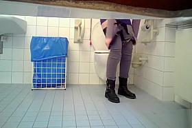 Irresistible babe takes a long piss in the restroom