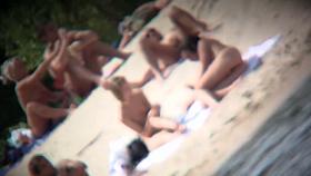 Nudist couples video clip by a hidden beach camera
