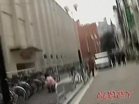 Occupied with the phone and a bicycle she got skirt sharked