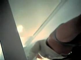 Spy cam chick demonstrates her long legs and sexy panty