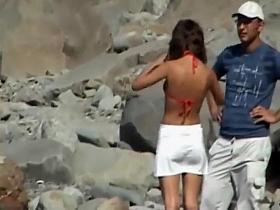 Skinny girl removes her bikini bottom