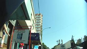 Upskirt voyeur gets up close and personal with a pantyless brunette