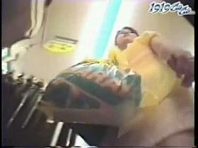 Upskirt porno video of several brunettes in a clothing shop