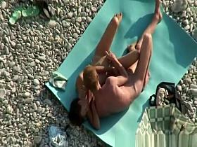 Nudist couple fucking in rocky beach