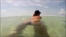 My busty girlfriend sticks a beer bottle in her vagina and swims around