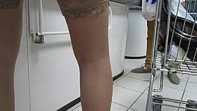 Girl in blue dress and tan stockings in supermarket 2