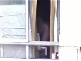 Naked chick is hiding behind curtains from my voyeur cam