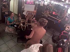 Tattooed chick puts lotion on stripper