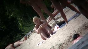 Beach voyeur vid of hippy blonde chick nude sunbathing