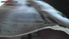 Slim babe shows off thong in candid upskirts video