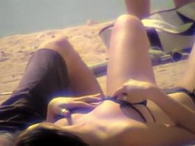 Hot downblouse nipple slip from girl on the beach