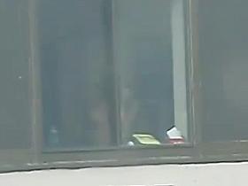 window voyeur - busty girl changing clothes