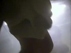 Big-breasted young woman takes off her clothes to dry her n