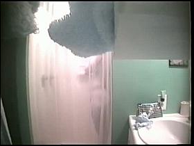 An alluring bimbo caught on a spy cam in the shower