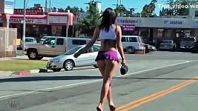 Raven-haired bombshell wears an extremely short skirt