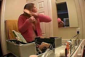 Kissy is currently cleaning her locks bare on-camera