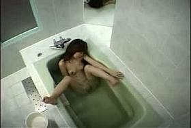 Naked Asian babe washing her hairy pussy and perky small boobs before masturbating