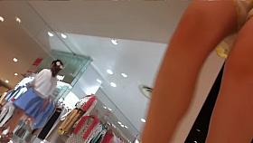 Brunette with amazing high heeled legs up the skirt