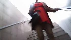 Girl in orange dress and tan stockings