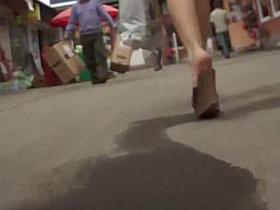 Voyeur upskirt pono video of a hot white lady in yellow/black dress.