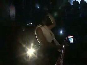 Sexy and horny brunette slut slapping her own ass in a disco