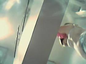 Woman flashes perky boobs in the changing room