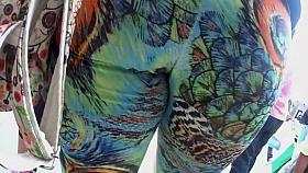 Big butt wiggles in peacock tights