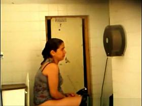 Co-worker pissing and cleaning her pussy