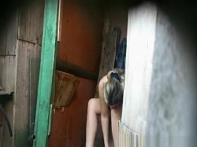 Girl caught peeing in an old wood toilet