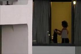 Imposing neighbor changes her clothes