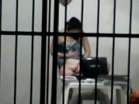 sexy brunette masterbates in a cell behind bars while on her laptop porn
